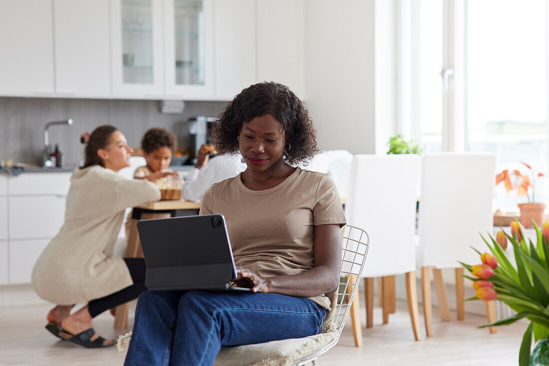 Family working and having meal at home