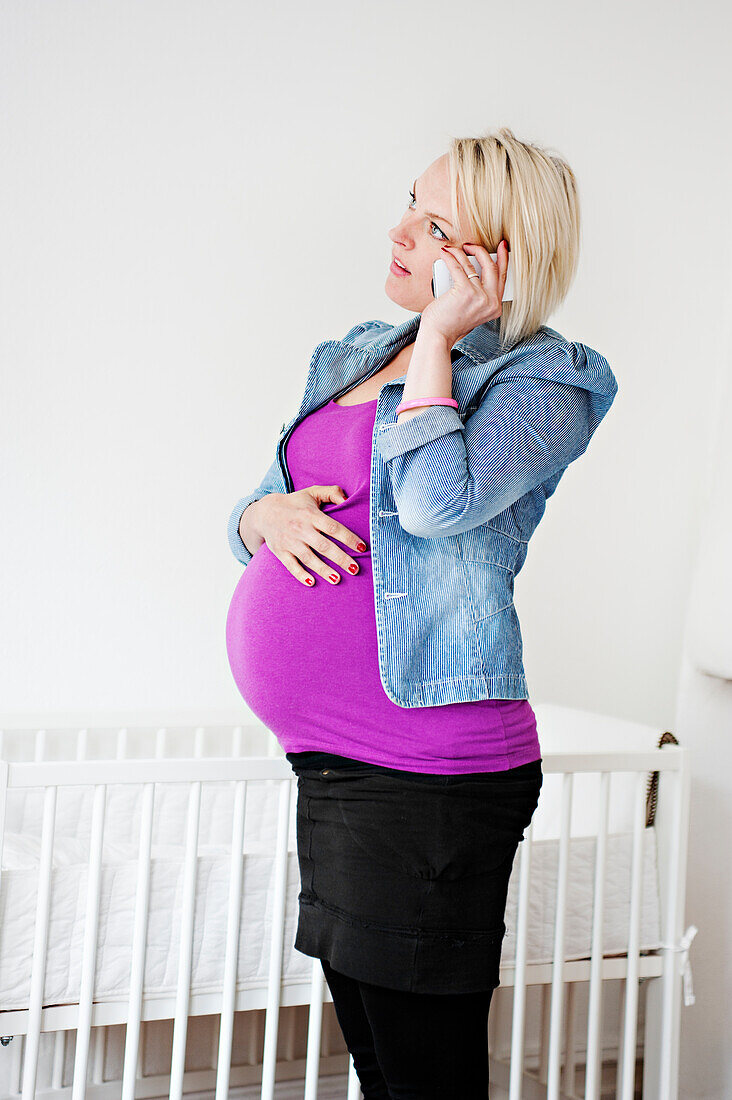 Pregnant woman talking on phone