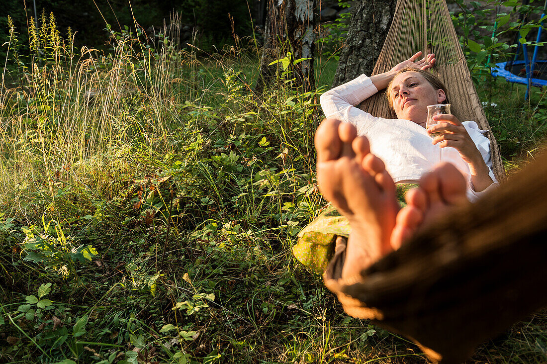 Woman relaxing on hammock