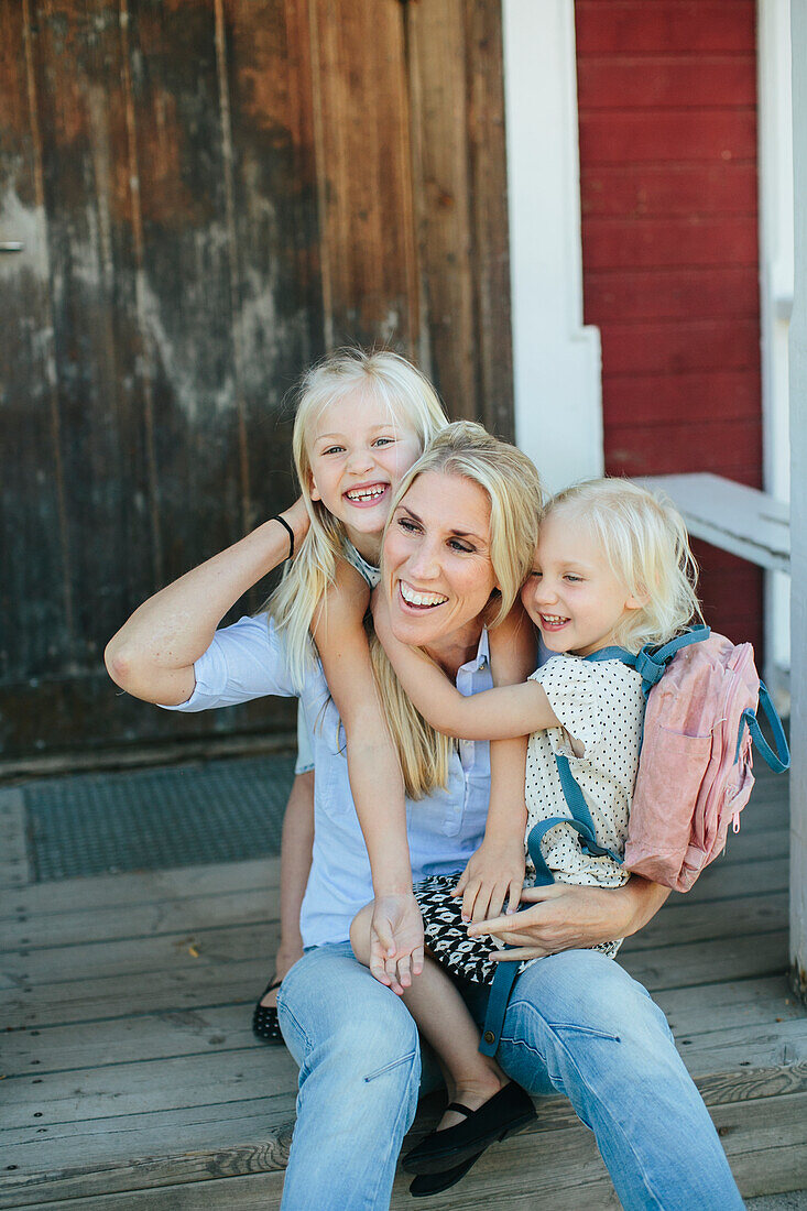 Happy mother with two daughter