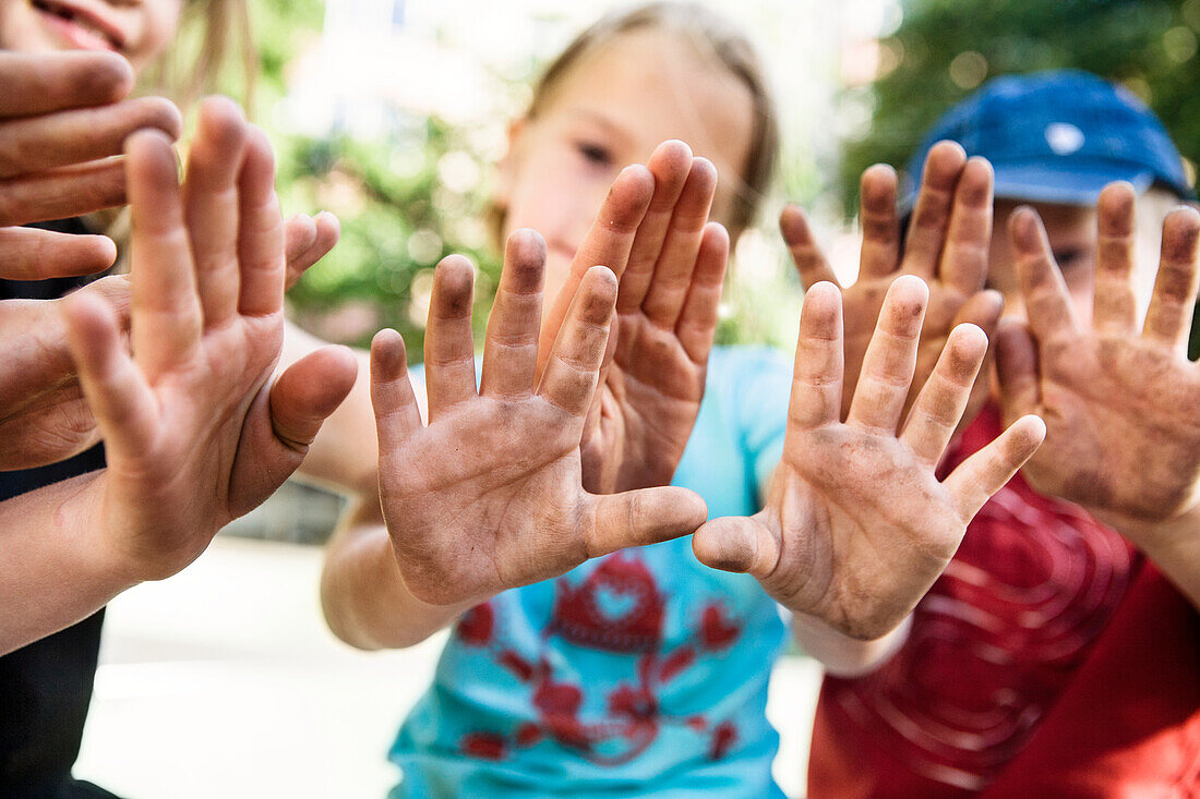 Children showing dirty hands