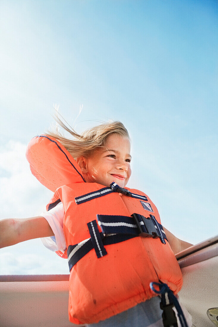 Smiling girl in life jacket