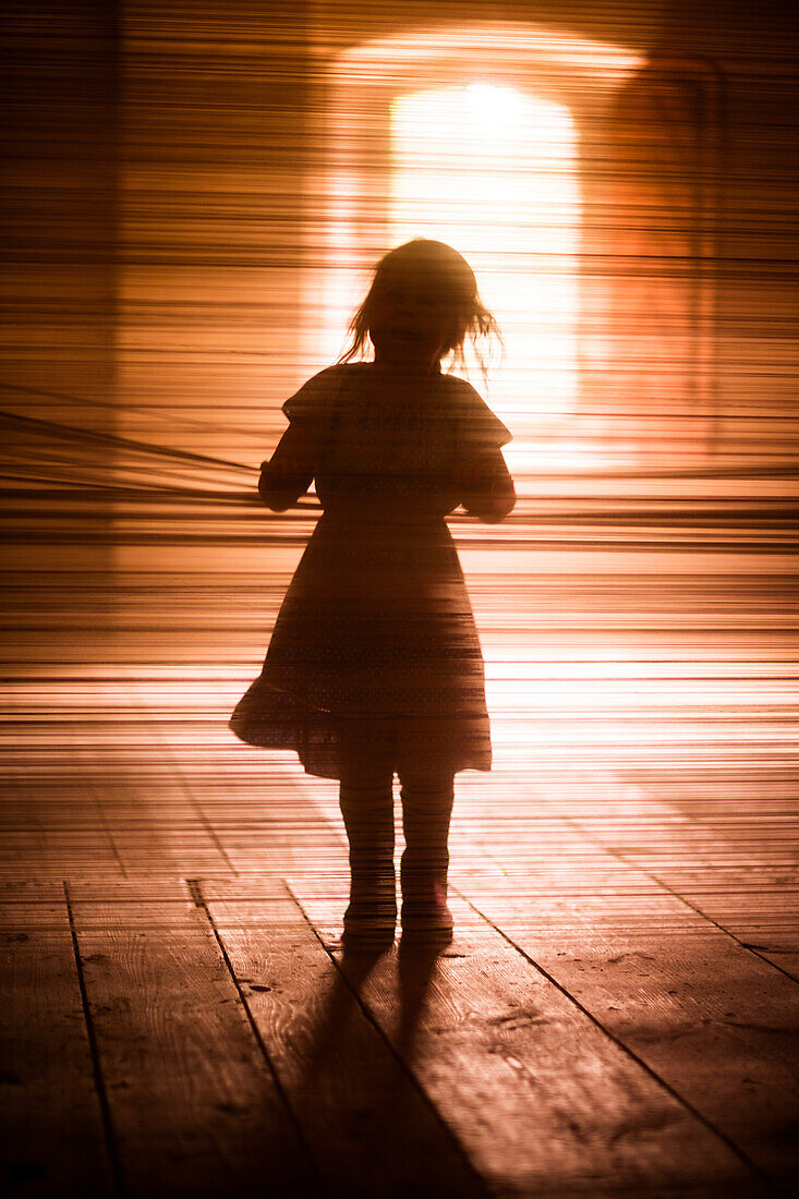 Silhouette of girl walking