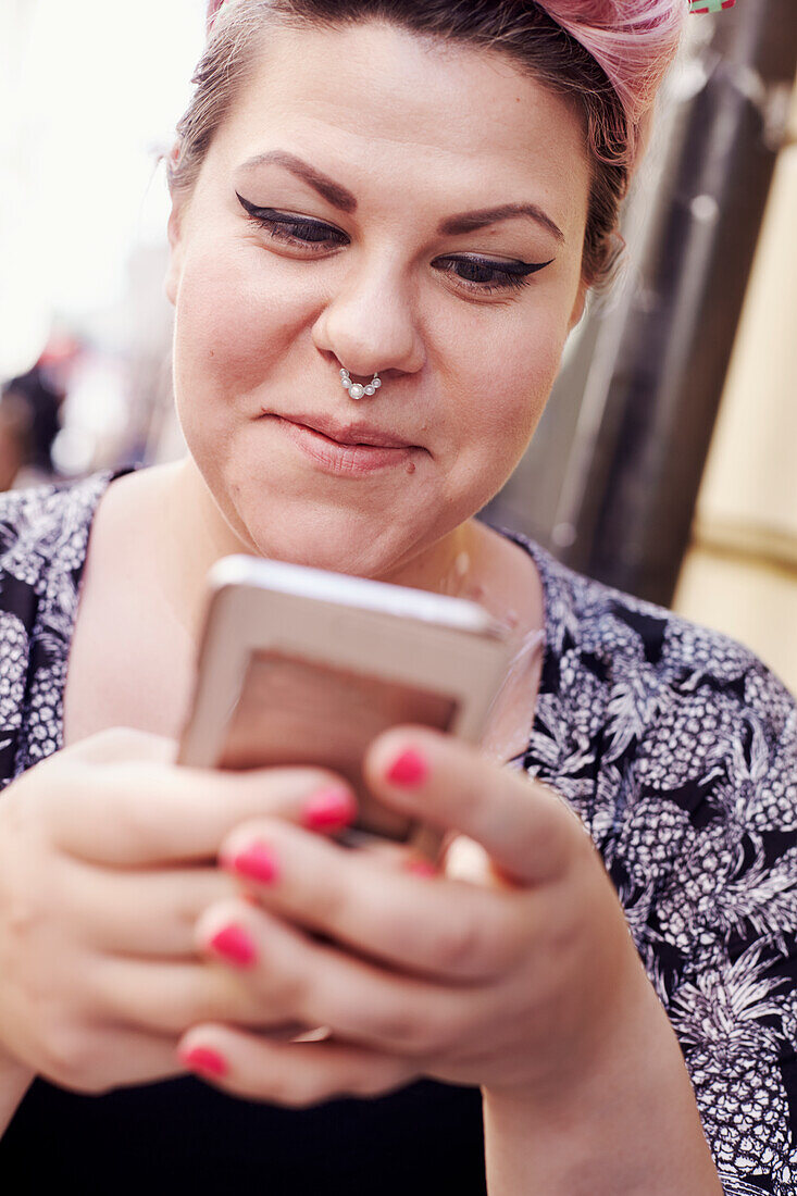 Young woman using cell phone