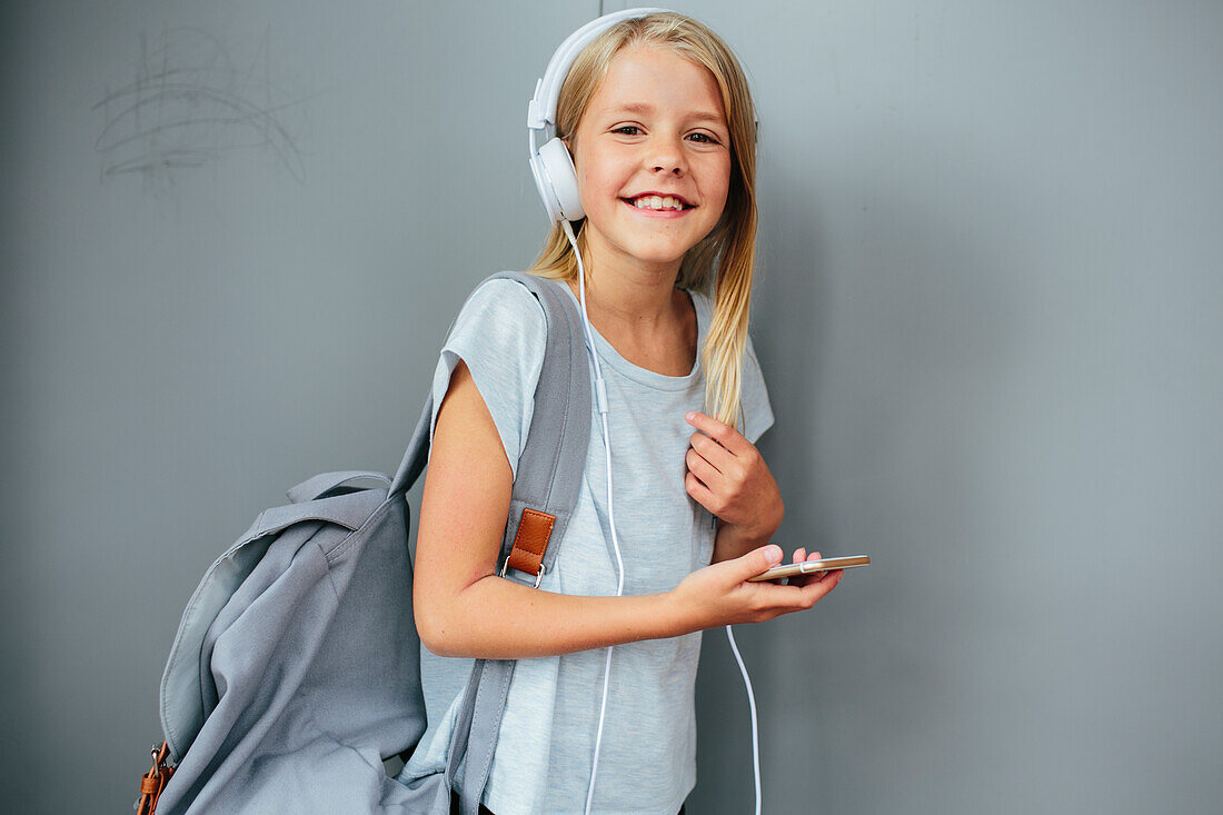 Smiling girl wearing headphones