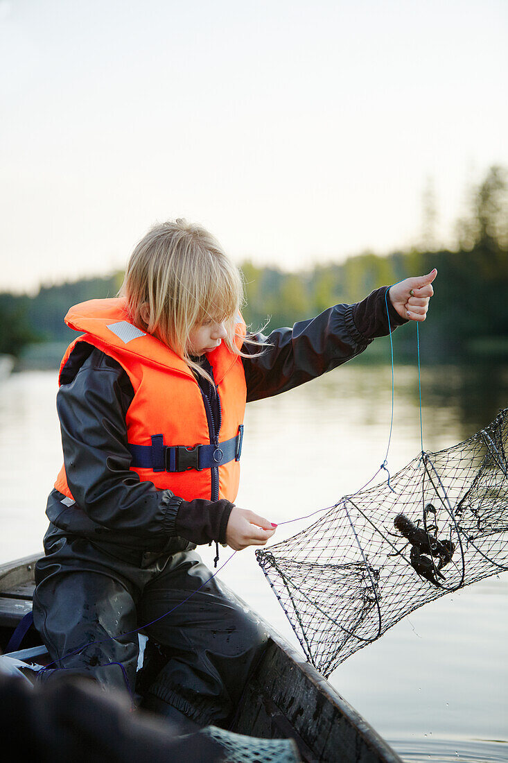 Girl with crayfish trap