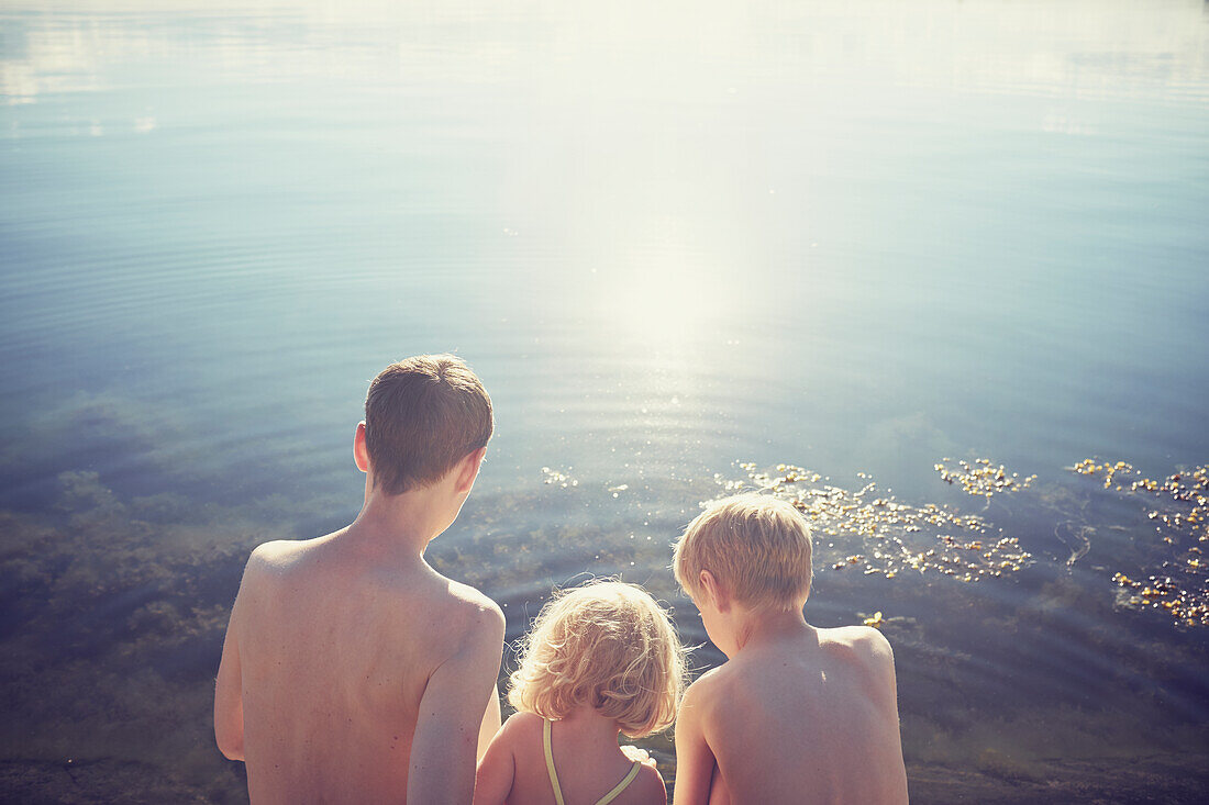 Mother with children at water