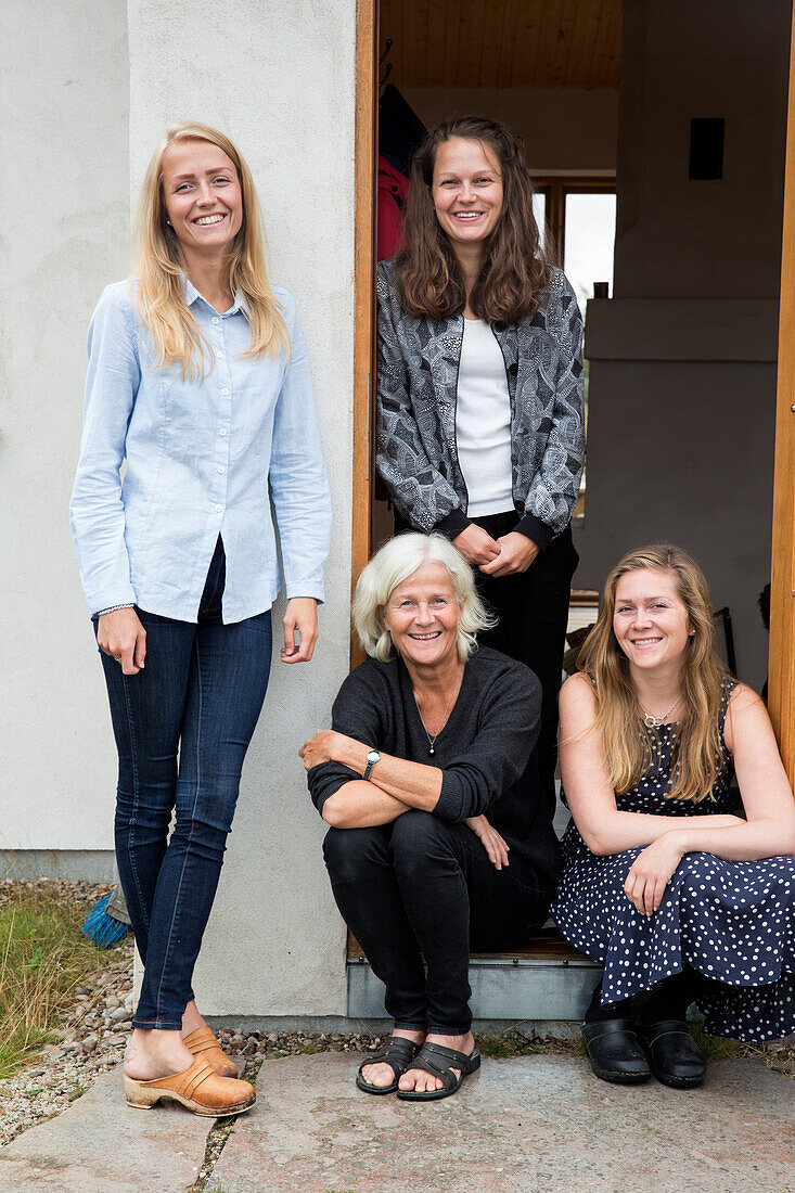 Senior woman with three adult granddaughters