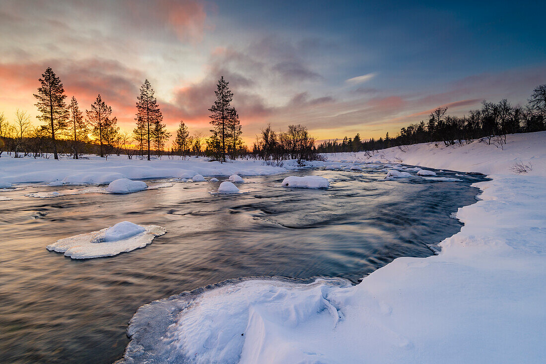 Winter landscape at sunrise