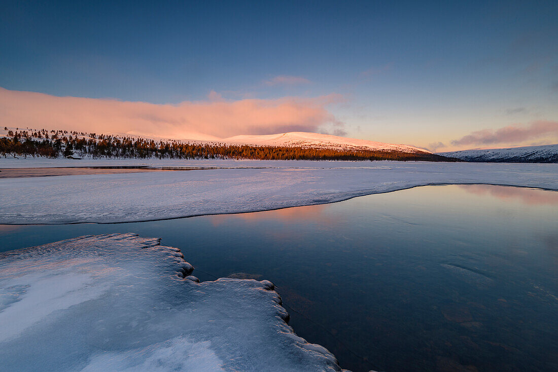 Winter landscape at sunrise