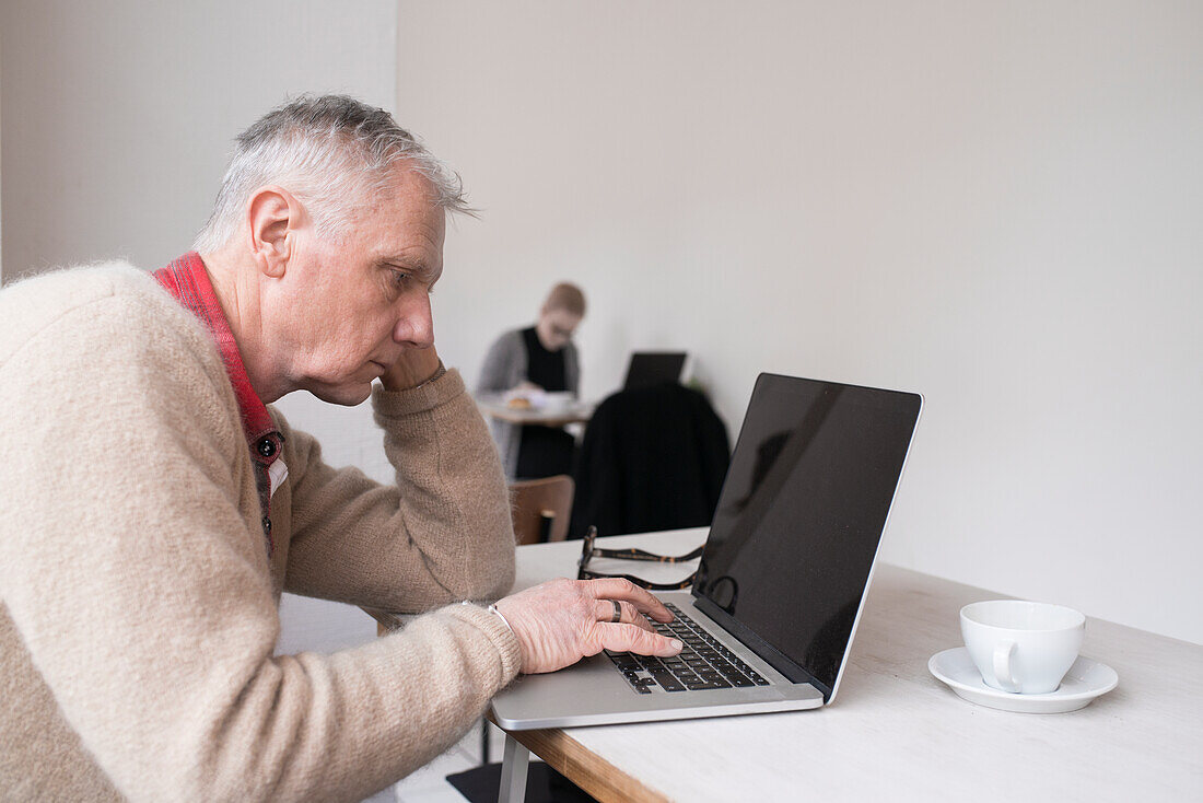 Senior man using laptop