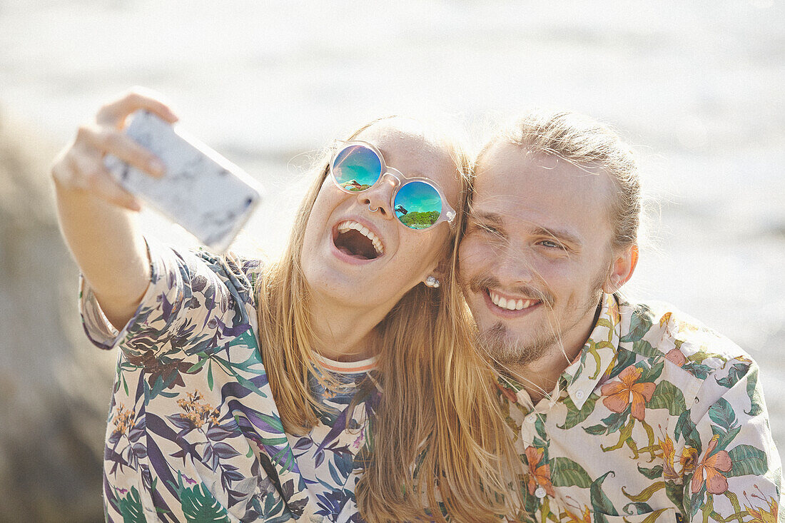 Happy couple taking selfie