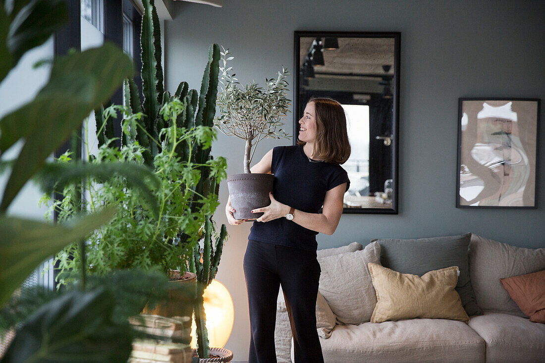 A woman takes care of plants