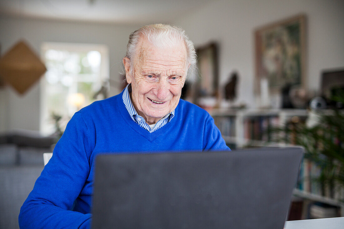 Senior man using laptop