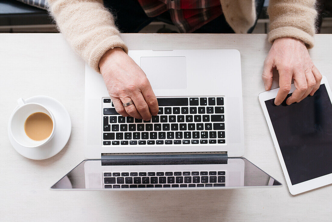 Hands on laptop keyboard