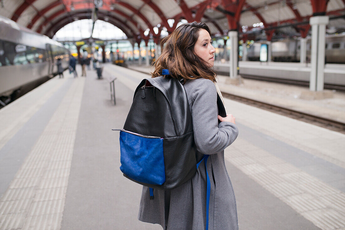 Woman on train station platform