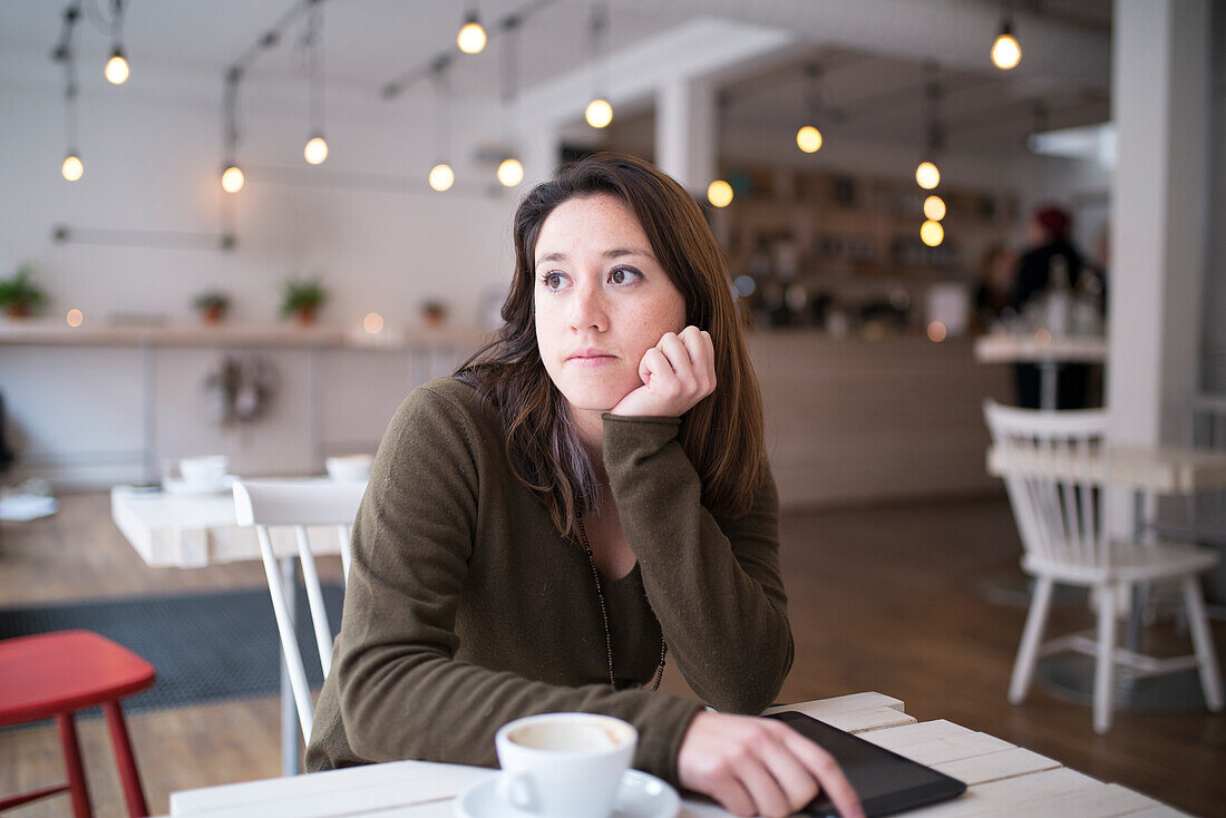 Thoughtful woman in cafe