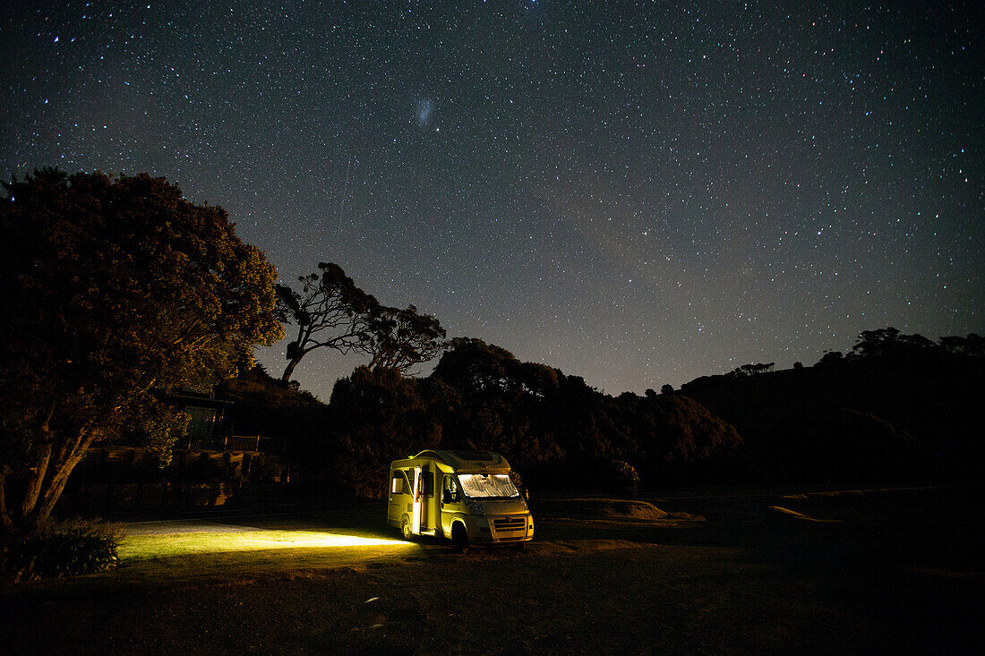 Illuminated caravan at night