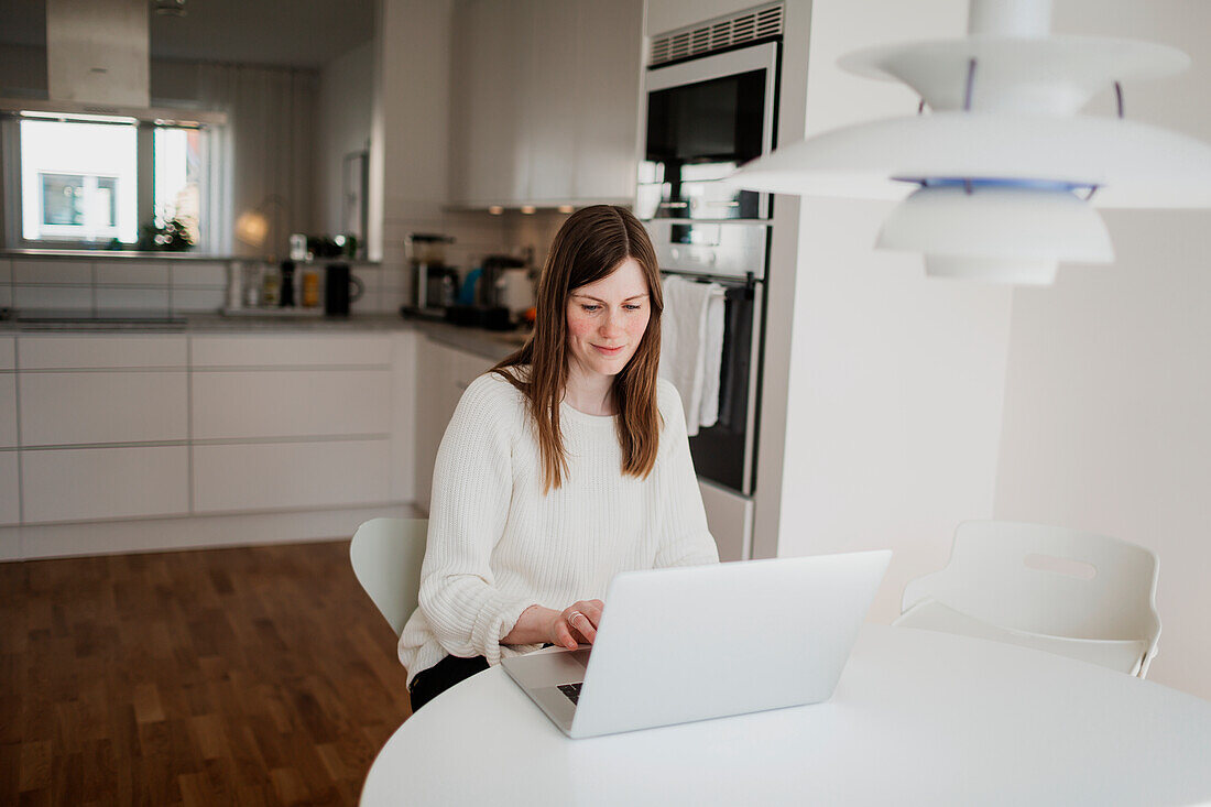 Young woman using laptop