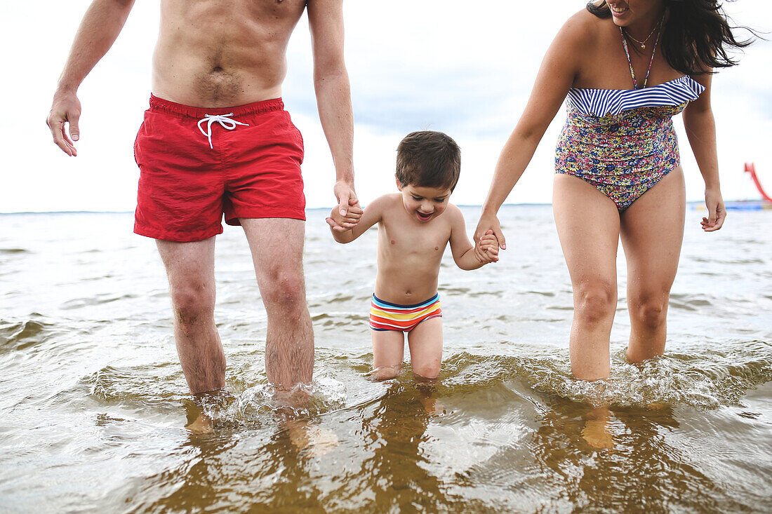 Family walking in water