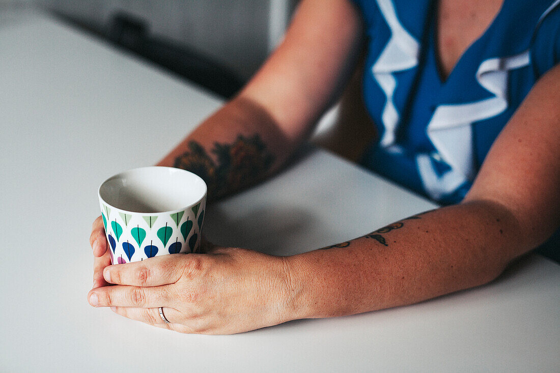 Hands with mug