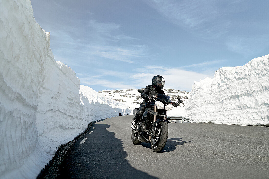 Biker on mountain road