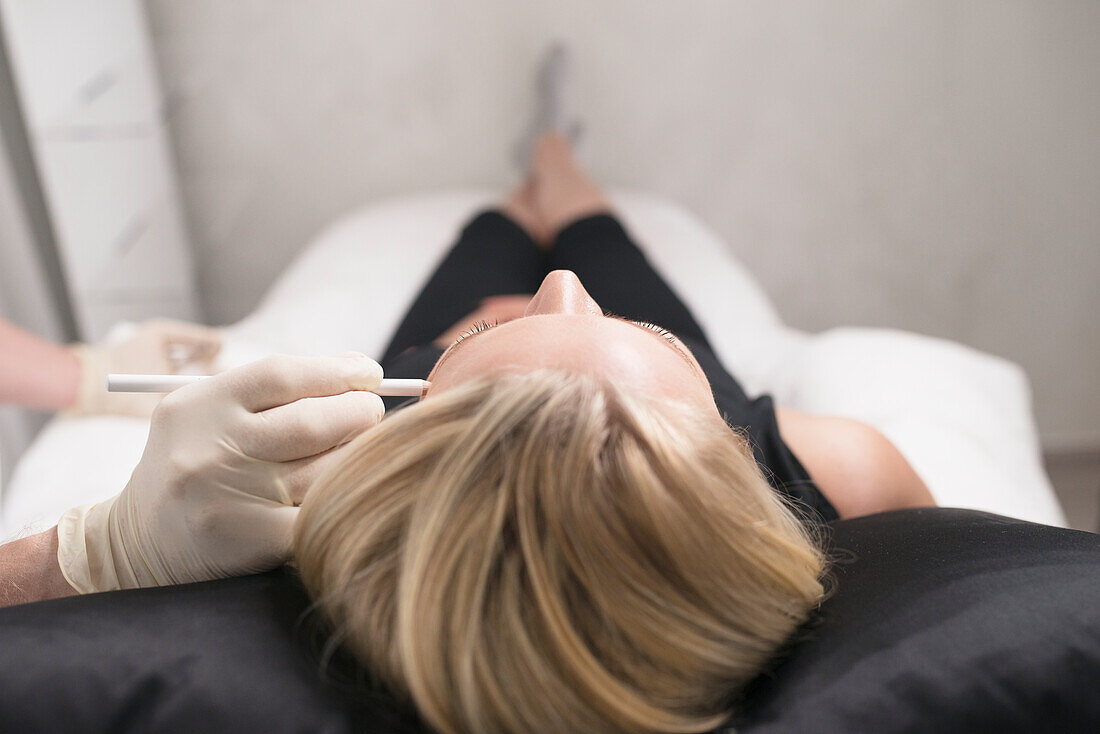 Woman in clinic of aesthetic medicine