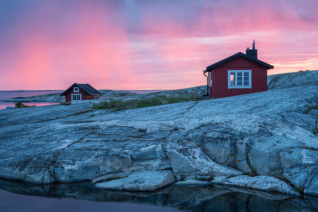 Wooden house on rocky coast