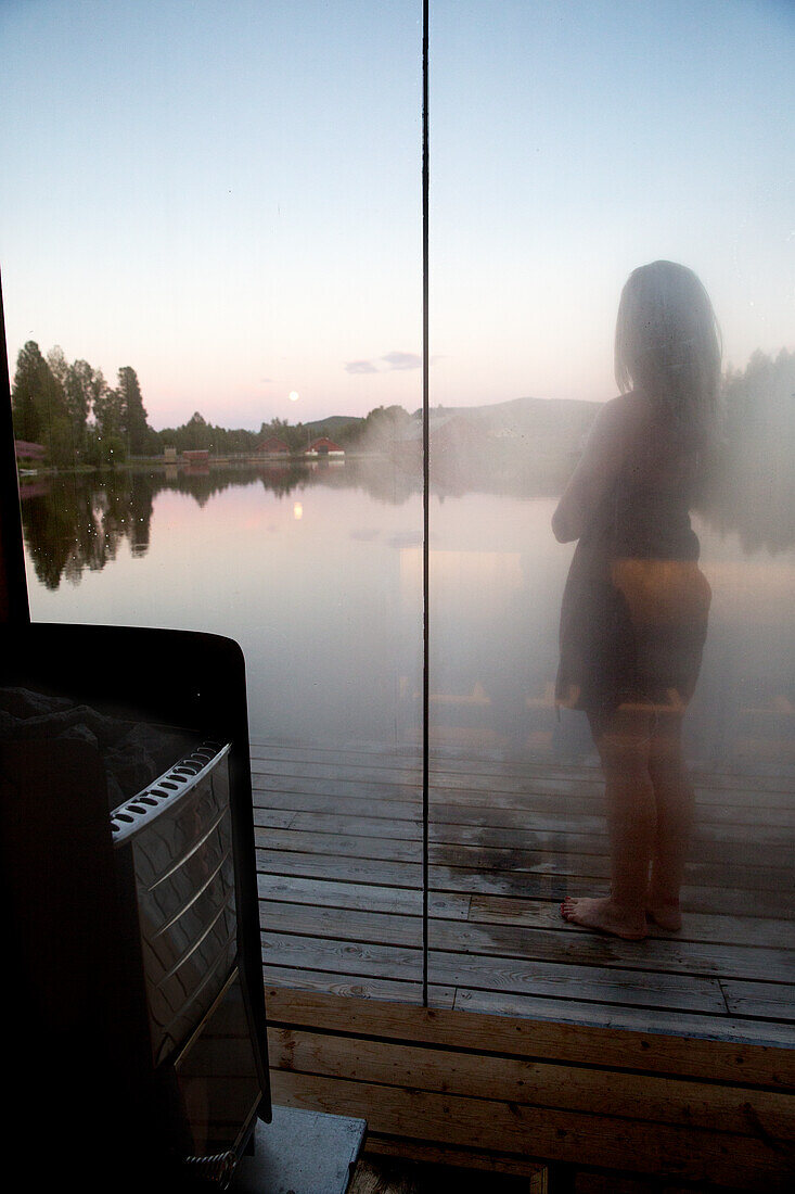 Girl seen through steamed glass