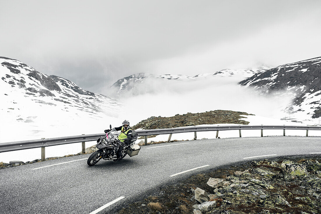 Biker on mountain road