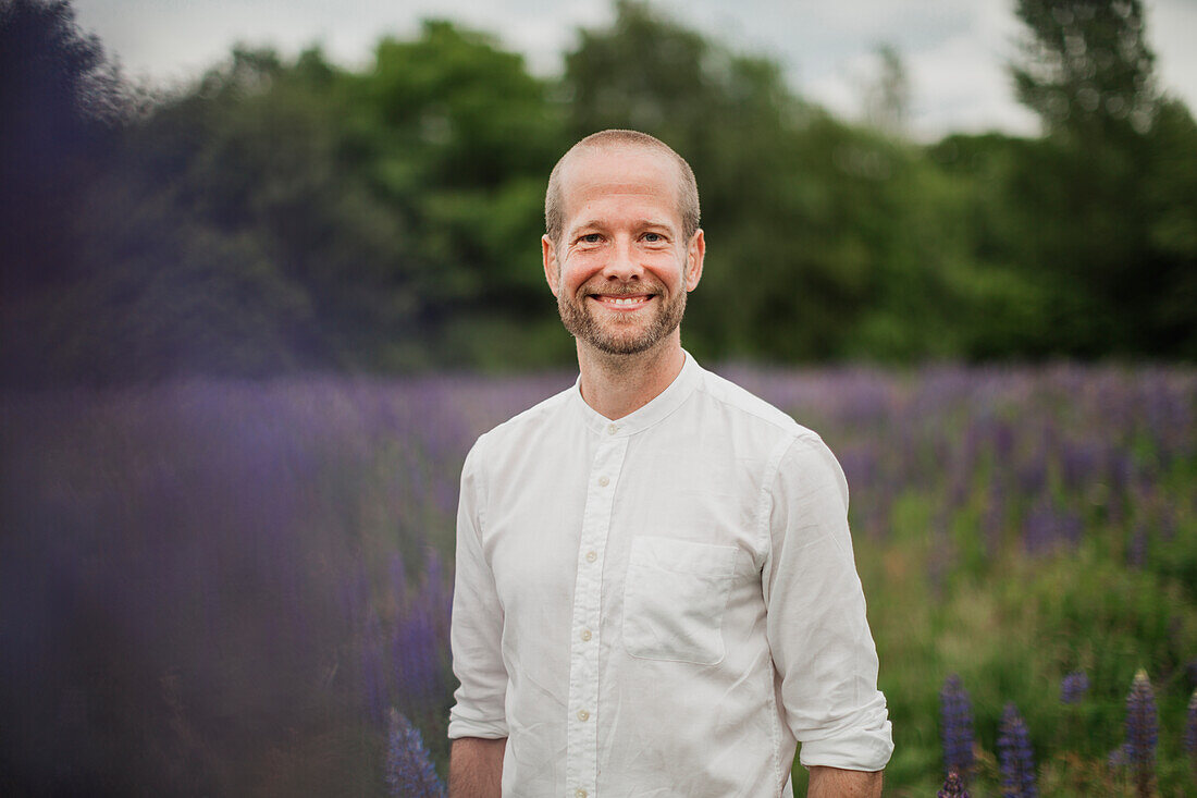 Portrait of smiling man on meadow