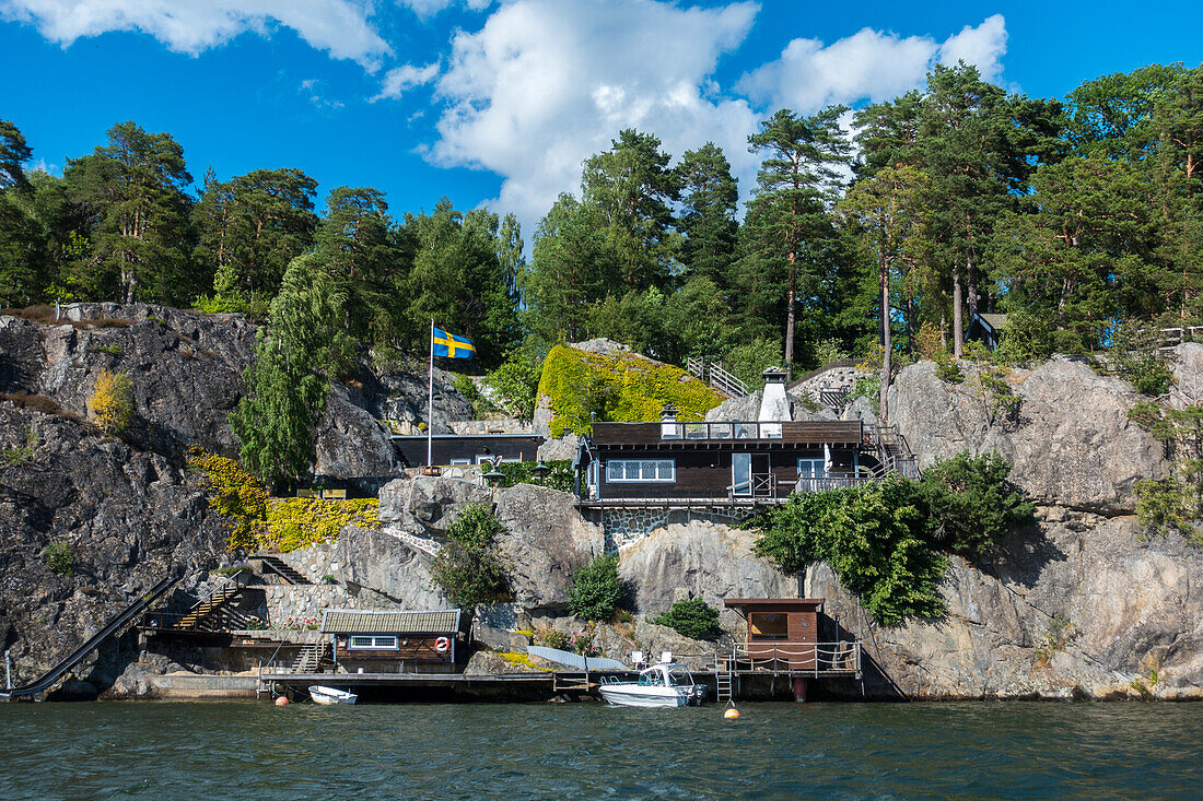 Wooden house on rocky coast