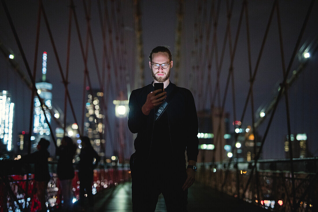 Man taking selfie on bridge