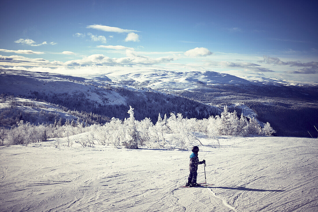 Boy skiing in mountains