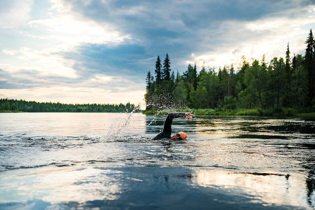 Person swimming in lake