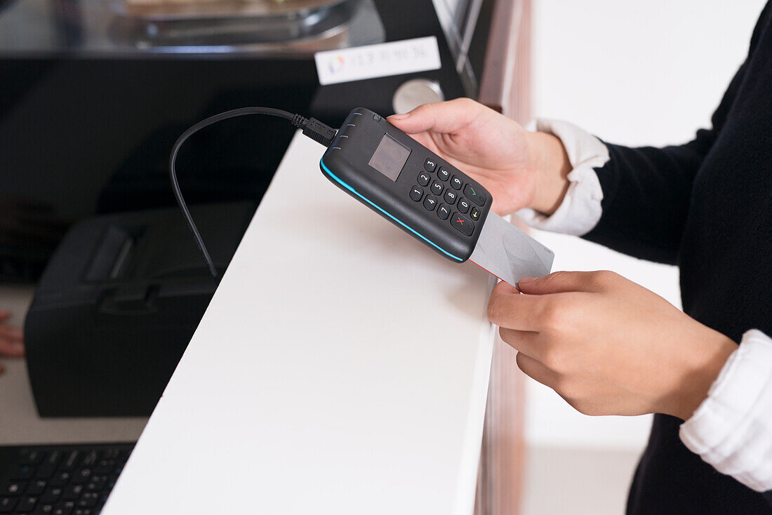 Woman paying with credit card