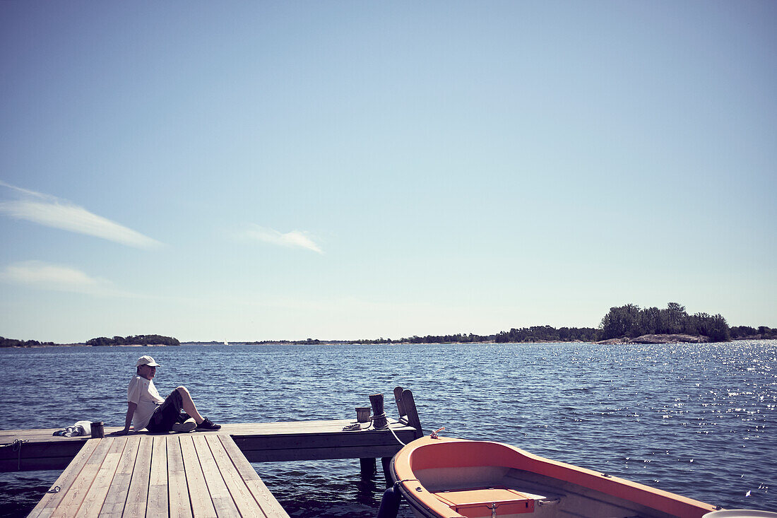 Man relaxing on jetty