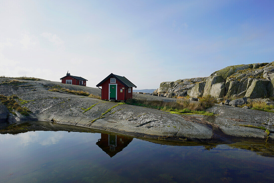 Wooden building on rocky coast