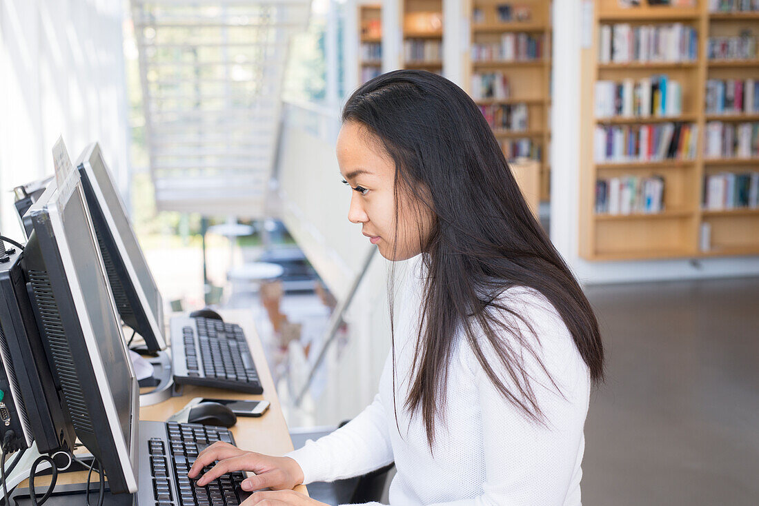 Young woman in library