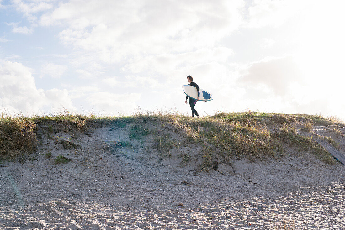 Female surfer with surfboard