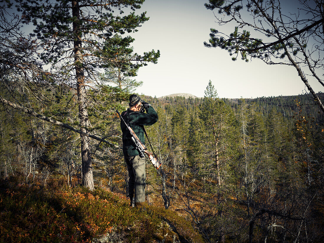 Man hunting in forest