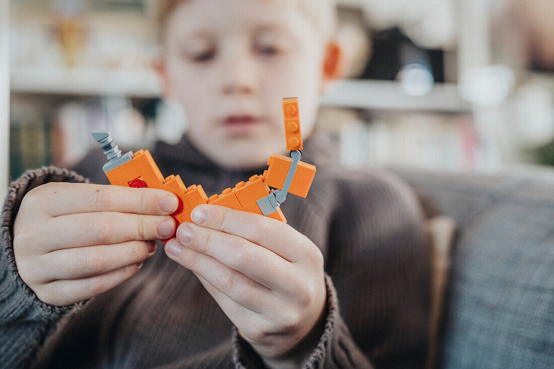 Boy playing Lego