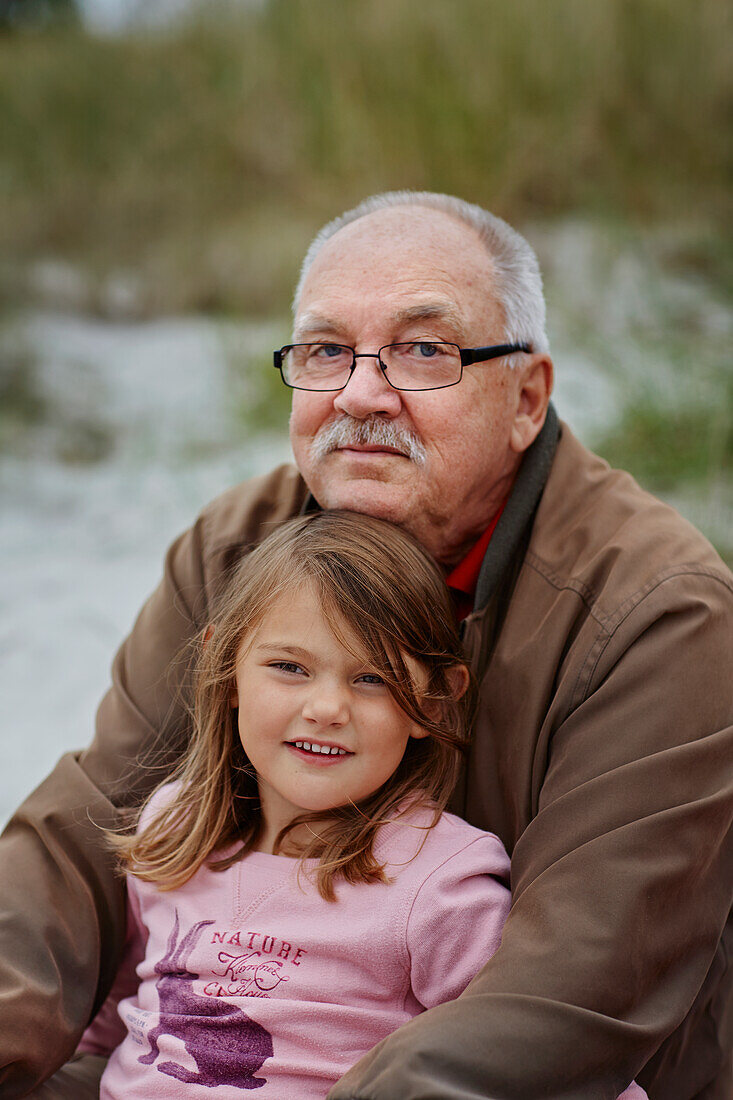 Portrait of grandfather with granddaughter