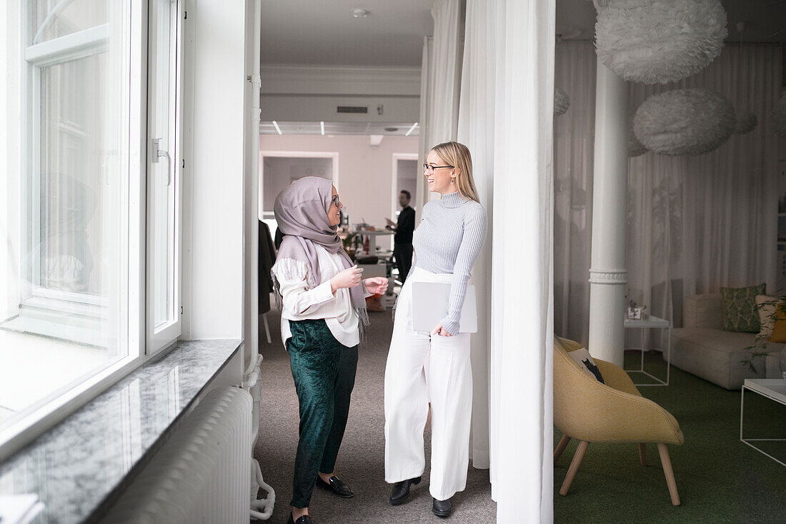 Two women working in office