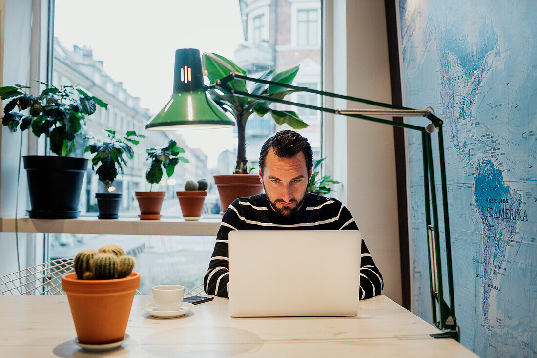 Man using laptop in studio