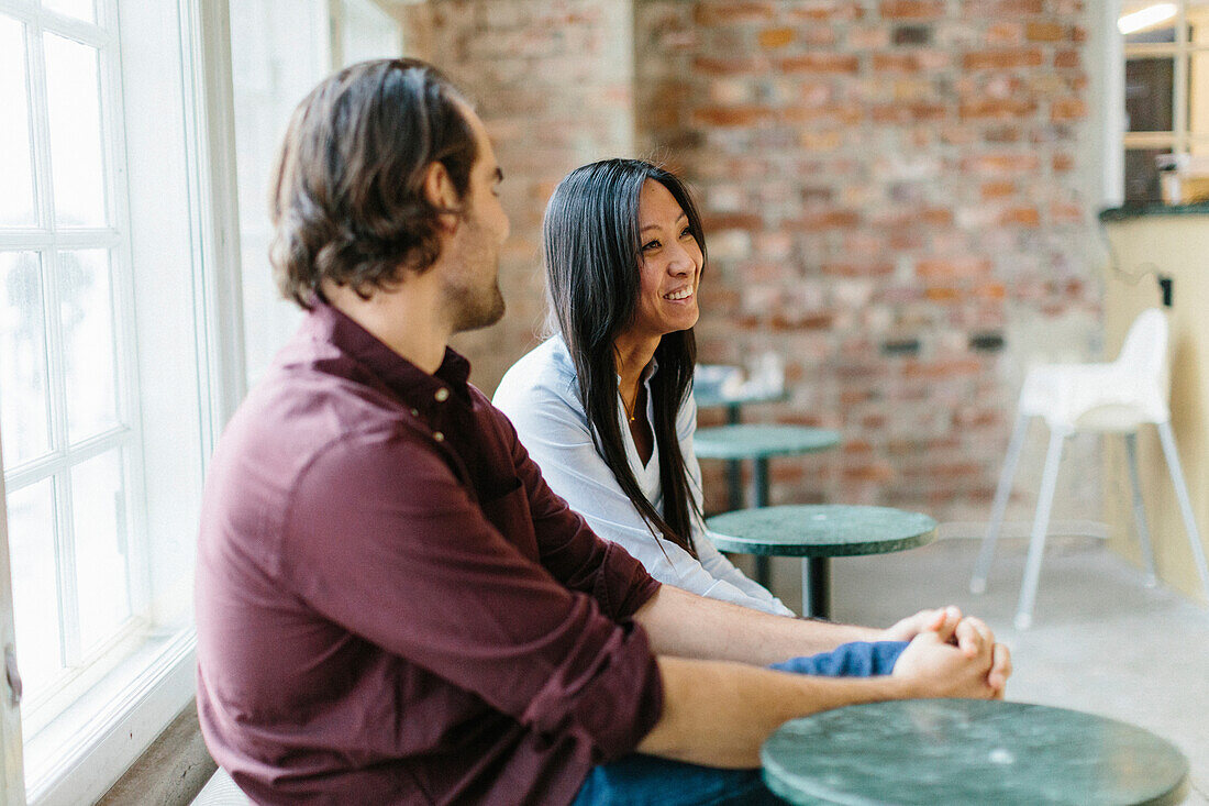 Colleagues talking in cafe