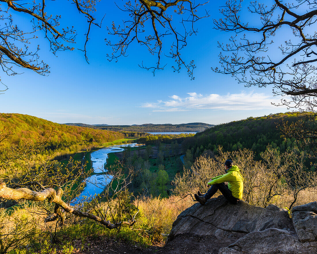 Hiker looking at river