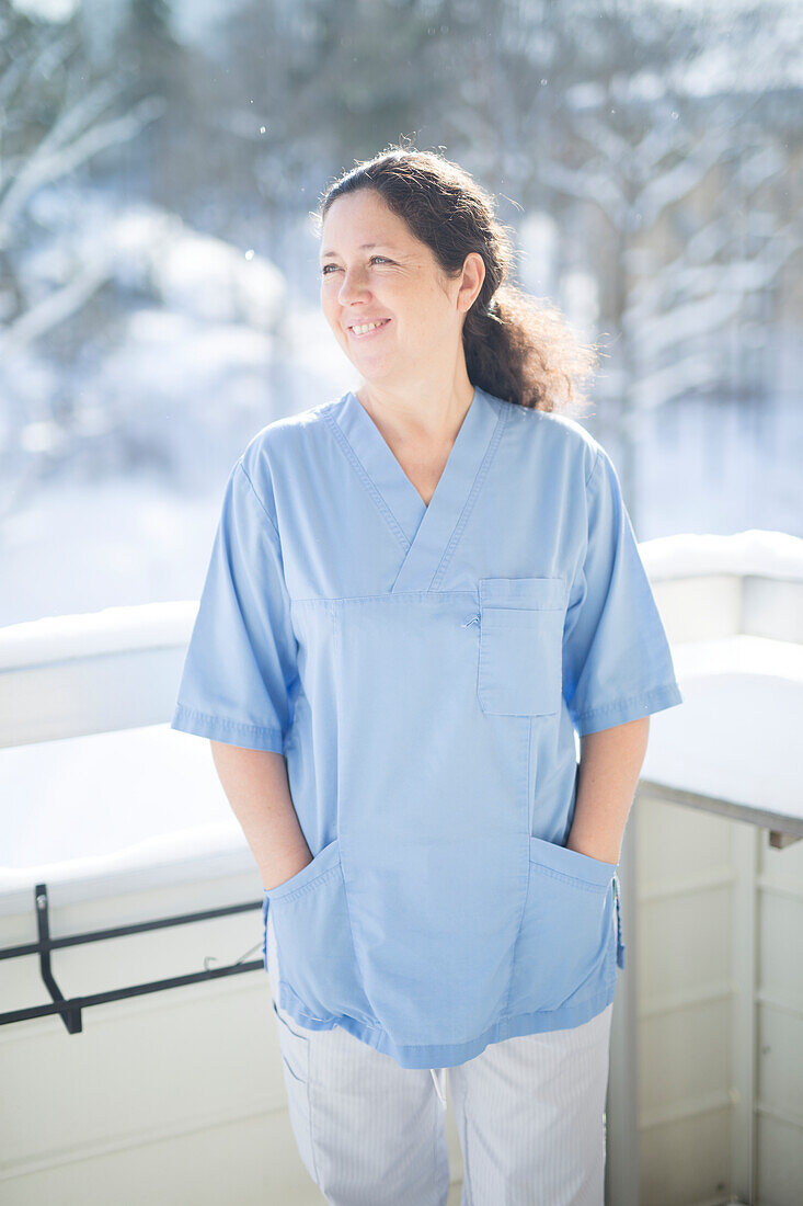 Nurse standing on balcony