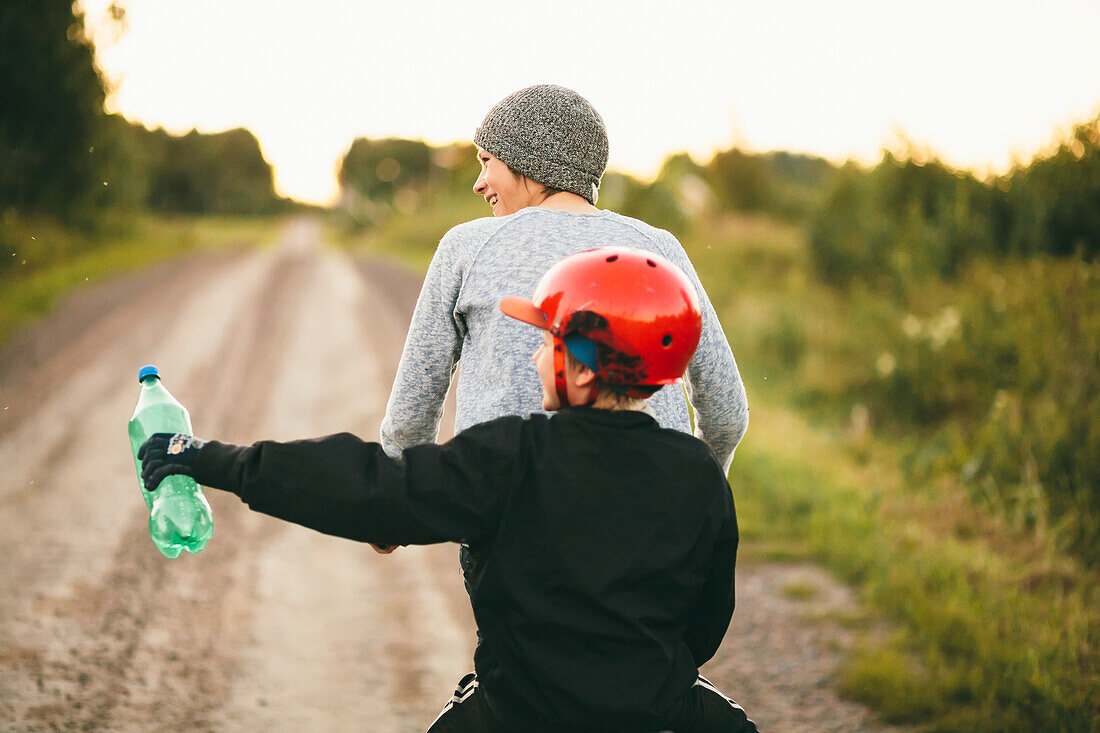 Mother with daughter cycling