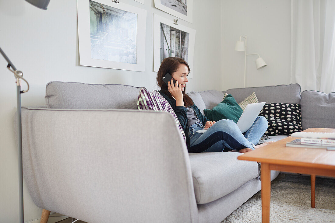 Young woman using laptop at home